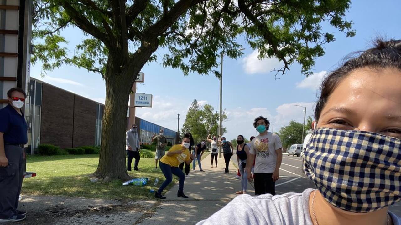 A group of volunteers taking a photo at a rally